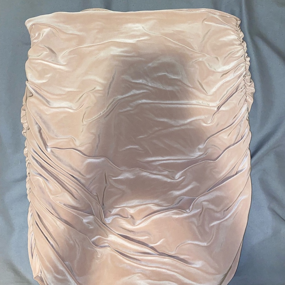 Nude color mini skirt